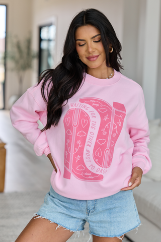 Waiting For The Other Boot To Drop Light Pink Graphic Sweatshirt, Pink Lily - A Blissfully Beautiful Boutique