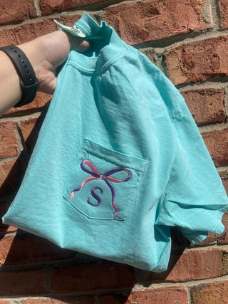 Two Tone Bow with Letter Embroidered Comfort Color Pocket Tee, Merch Girls - A Blissfully Beautiful Boutique
