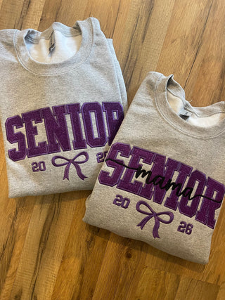 Senior with optional MAMA overlay text Established Year Coquette Bow Varsity Glitter Applique Embroidered Shirt, Merch Girls - A Blissfully Beautiful Boutique