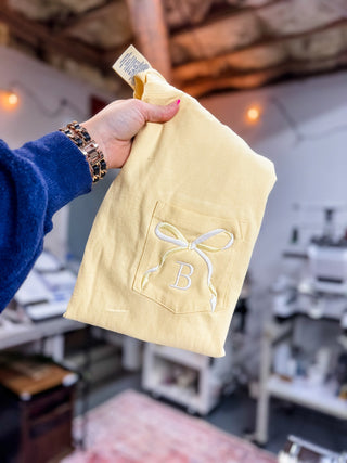 Two Tone Bow with Letter Embroidered Comfort Color Pocket Tee, Merch Girls - A Blissfully Beautiful Boutique