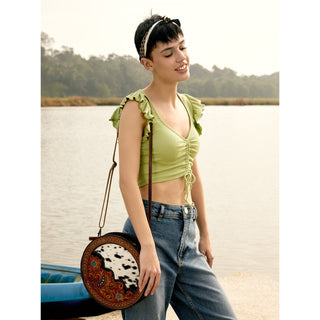 Myra Simply Sober Round Hairon Leather Crossbody â€“ Handtooled Floral & Cowhide Circle Bag for Carnival Adventures, Myra USA - A Blissfully Beautiful Boutique